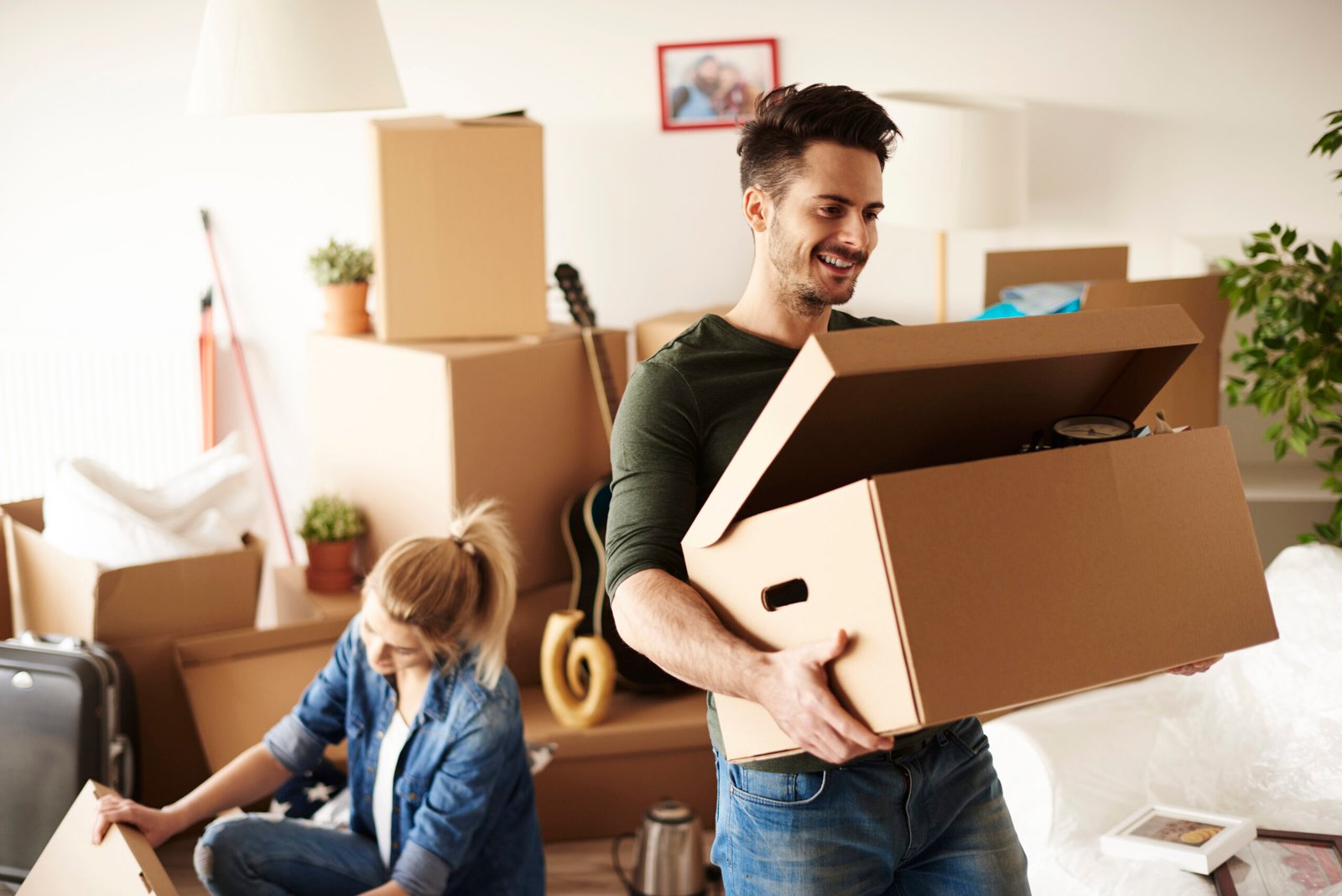 Young couple moving in to house